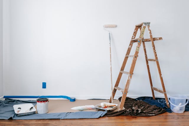 Ladder and paint supplies inside a home