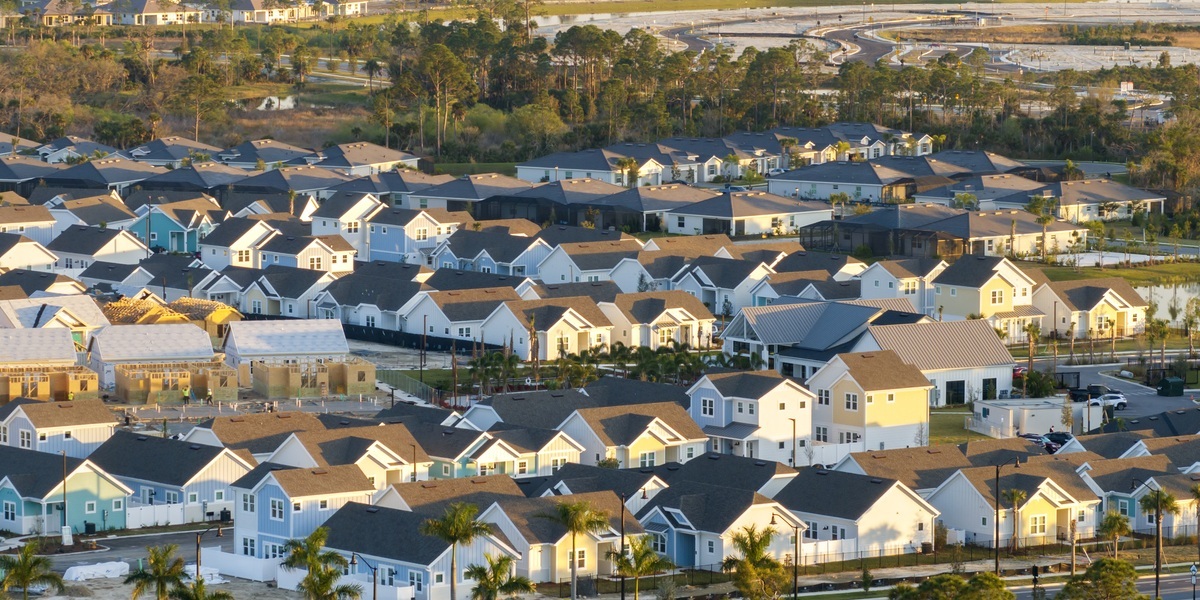 Aerial Perspective of a Modern Suburban Housing Development at Sunset