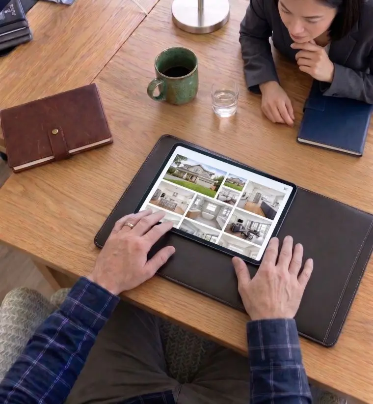 Property managers reviewing listings on a tablet